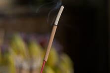 Burning incense stick, in Sherbrooke.